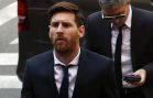 Barcelona’s Argentine soccer player Lionel Messi arrives to court with his father Jorge Horacio Messi to stand trial for tax fraud in Barcelona