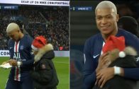 Kylian-Mbappe-signs-an-autograph-for-a-young-pitch-invader-in-a-beautiful-moment-during-PSG-vs-Amiens